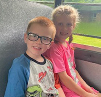 smiling students on school bus